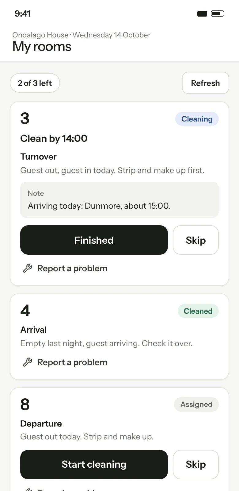 A housekeeper's round on a phone: their rooms in order, the time each must be clean by, a note from the front desk, and one big button for the next step. Illustration with sample data.